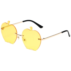 Lunettes de soleil sans monture en forme de pomme avec verres jaunes et métal doré
