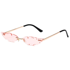 Pink feather-cut rimless sunglasses with gold metal temples and unique serrated lens