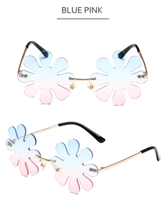 Macro view of flower-shaped rimless sunglasses featuring blue pink gradient lenses