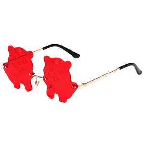 Cartoon tiger shaped sunglasses with red lenses and golden metal frame for parties