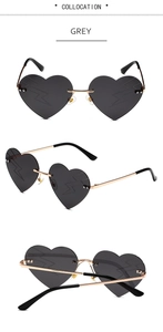 Frameless heart-shaped grey sunglasses with golden metal legs and lightning pattern lens
