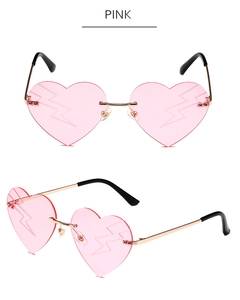 Detail of pink heart-shaped rimless sunglasses with lightning bolt laser engraving