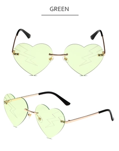 Detail of green heart-shaped rimless sunglasses with lightning patterns and gold frames