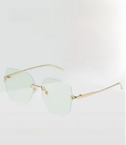 Detail of blue rimless blue light blocking glasses with sleek gold metal temples