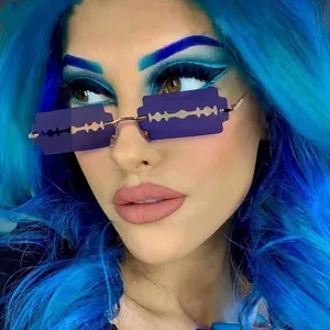 Detailed close-up of purple gradient razor blade shaped rimless sunglasses with gold frame