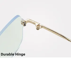Close-up of golden metal hinge on rimless anti-blue light glasses with sturdy screw detail