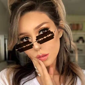 Close-up of woman wearing avant-garde black razor blade shaped sunglasses with silver metal temples