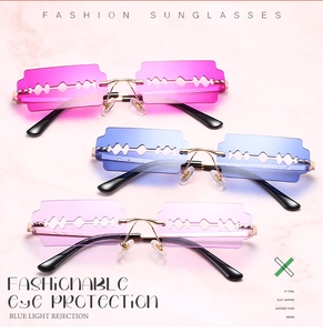 Close-up of blade-shaped rimless sunglasses in pink, blue, and purple with blue light protection