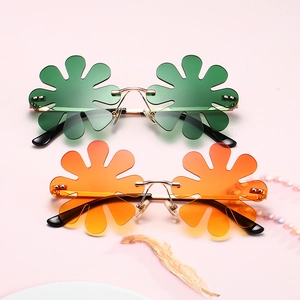 St. Patrick's Day flower shaped rimless party sunglasses with green and orange lenses