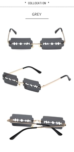 Macro detail of razor blade shaped grey lenses with premium gold metal frames