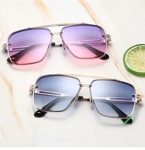 Close-up of double bridge metal pilot sunglasses with purple and blue gradient lenses