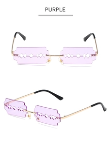 Detailed view of purple blade-shaped lenses with gold metal frames and nose pads