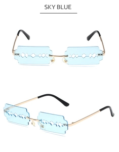 Detail of sky blue razor blade shaped rimless sunglasses with gold metal frame accents