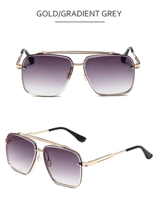 Detail of pilot sunglasses with gold double-bridge metal frame and grey gradient lenses