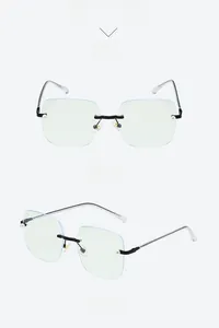 Detail view of rimless square glasses with pearl accents and black metal temples