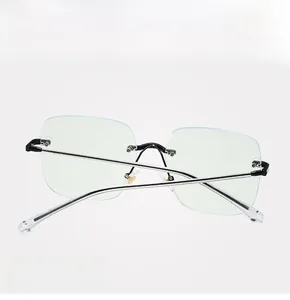 Detail view of rimless blue light blocking glasses with sleek metal temples and nose bridge