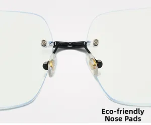 Detail showing eco-friendly nose pads and black metal bridge on rimless glasses
