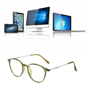 Close-up of retro blue light blocking glasses with light olive resin frame and metal temples