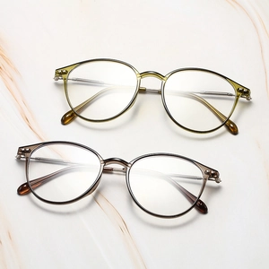 Close-up of retro round eyewear frames with silver metal temples and rivet details