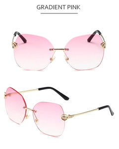 Macro detail of gradient pink rimless sunglasses with gold metal cheetah head temple decoration