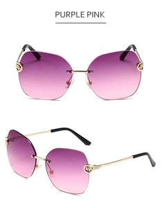 Detail of rimless gradient purple pink sunglasses with a gold leopard head ornament