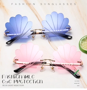 Detail of shell-shaped rimless sunglasses in blue and pink gradients with gold hardware