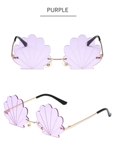 Detail of purple shell-shaped rimless sunglasses with gold metal temples and texture