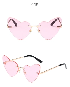 Detailed views of rimless heart-shaped pink sunglasses with slim gold metal frame