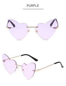 Detail view of purple heart-shaped rimless sunglasses with gold metal temples