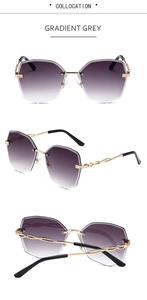 Détail de lunettes de soleil sans monture avec verres dégradés et branches dorées
