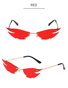 Detailed close-up of red flame-shaped rimless sunglasses with gold metal temples