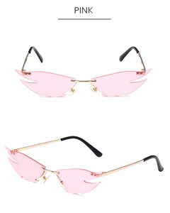 Detailed views of rimless cat-eye sunglasses with pink flame-shaped lenses and gold frame