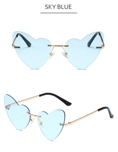 Detail of sky blue heart-shaped rimless sunglasses with gold metal temples