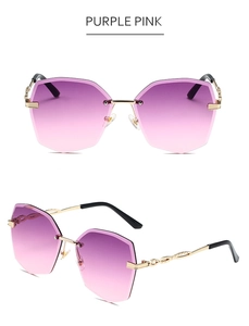 Vue détaillée de lunettes de soleil sans monture dégradé rose-violet et branches dorées