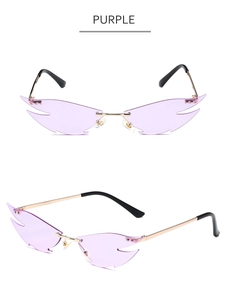 Detail view of purple flame-shaped rimless sunglasses with gold metal frame