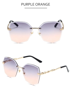 Détail de lunettes de soleil sans monture avec dégradé violet orange et branches dorées