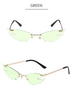 Detailed view of frameless flame-shaped cat eye sunglasses with light green lenses and gold frame