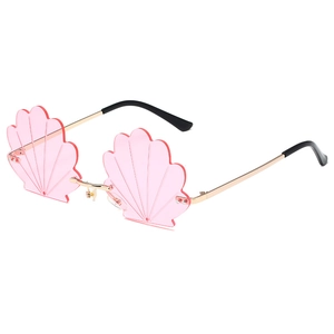Pink shell-shaped rimless sunglasses with gold metal frame and wavy textured lenses