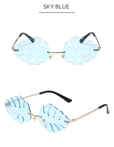 Close-up of sky blue leaf-shaped lenses with gold metal frames and clear nose pads