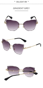Detailed view of rimless butterfly sunglasses with gradient grey lenses and gold temples