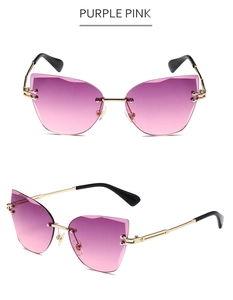 Detailed close-up of rimless cat-eye sunglasses with purple pink gradient lenses and gold temples