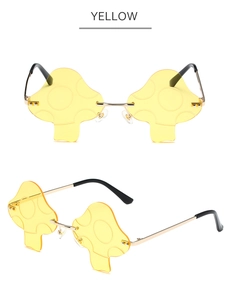 Close-up of yellow mushroom-shaped rimless sunglasses with textured lenses and gold frames