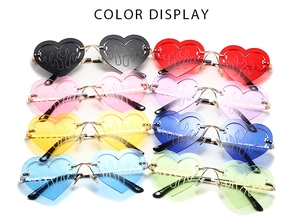 Colorful heart-shaped flame sunglasses in eight vibrant colors with rimless design