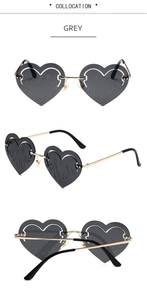 Detail of grey heart-shaped flame sunglasses with gold metal frame from multiple angles