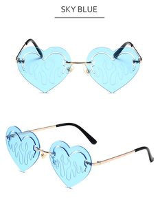Detail of sky blue heart-shaped flame sunglasses with elegant golden metal frame