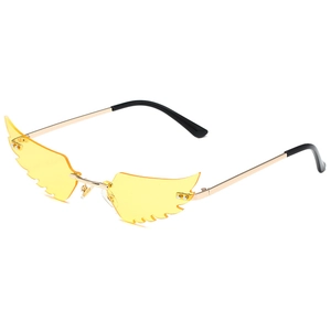 Unique wing-shaped rimless sunglasses with yellow lenses and gold metal frames