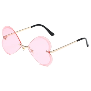 Lunettes de soleil cœur sans monture pour femmes avec verres roses et monture en métal doré