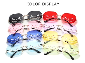 Collection of pumpkin face rimless sunglasses in eight different vibrant colors for parties