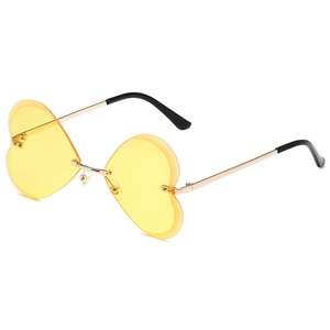 Lunettes de soleil cœur sans monture avec verres jaunes et monture en métal doré