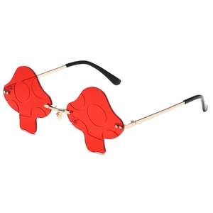 Fashionable rimless mushroom-shaped sunglasses with red lenses and gold metal temples